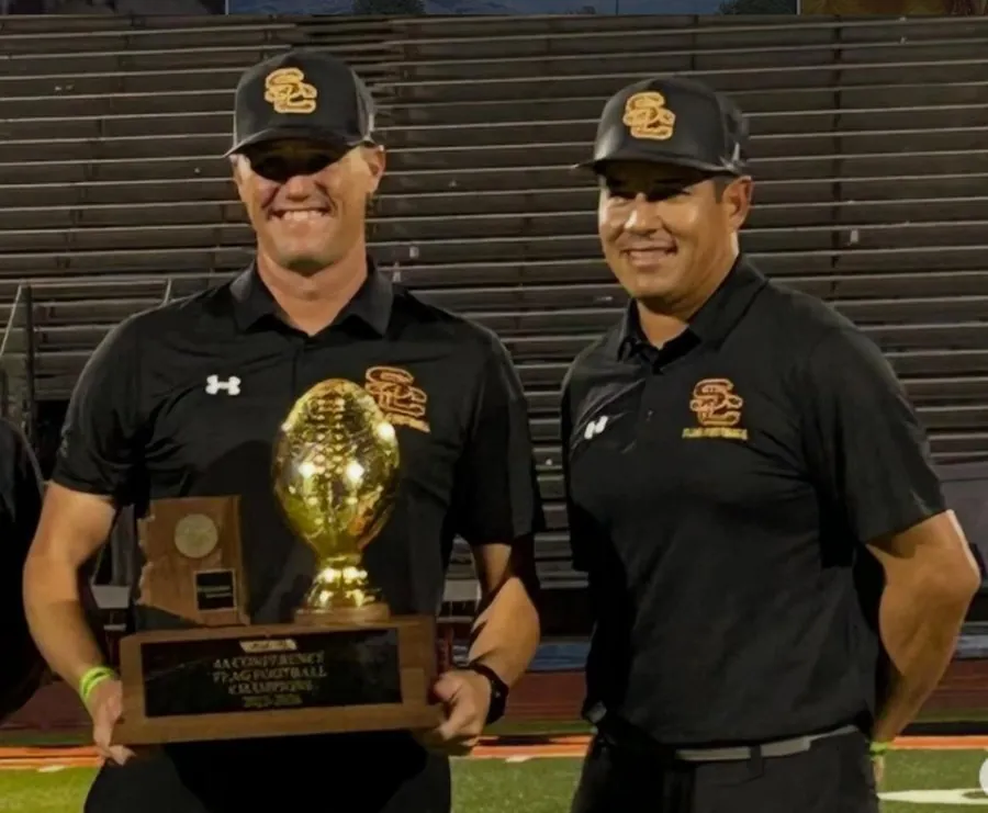 League coaches with the 2025 4A Women's Flag Football State Championship trophy