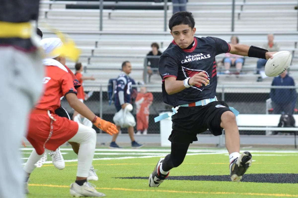 Tucson player cutting upfield in an Arizona Cardinals Regional jersey with tournament bleachers behind