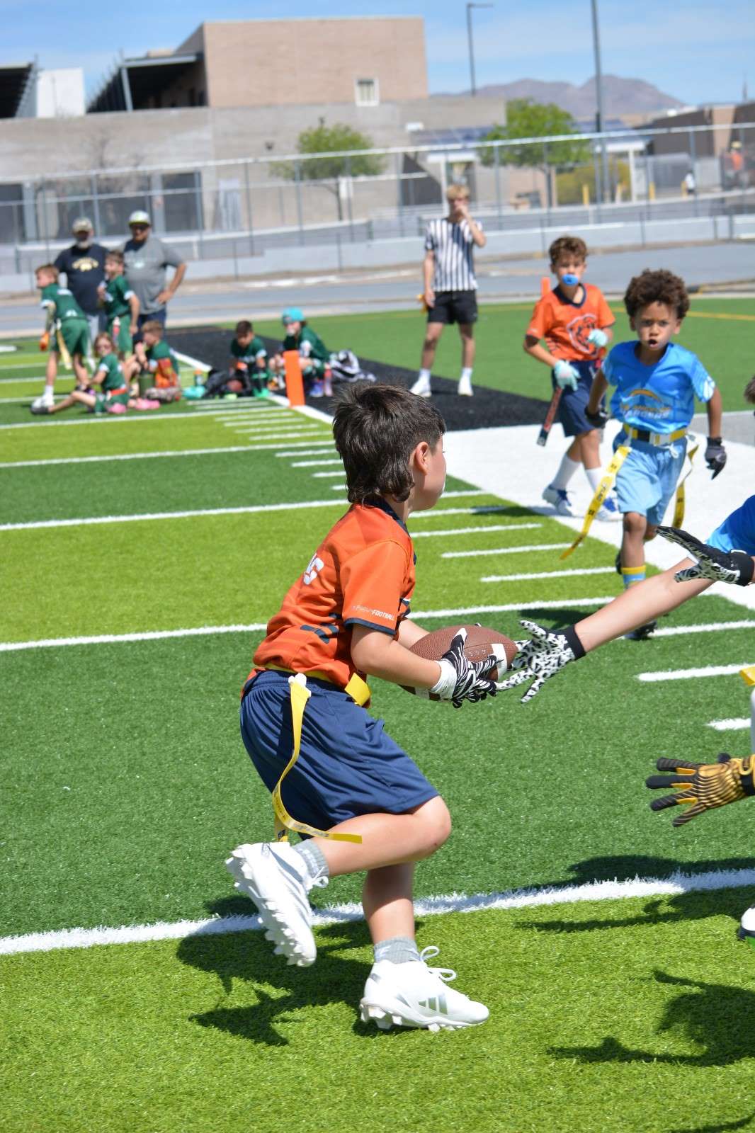 Young players diving for a flag pull