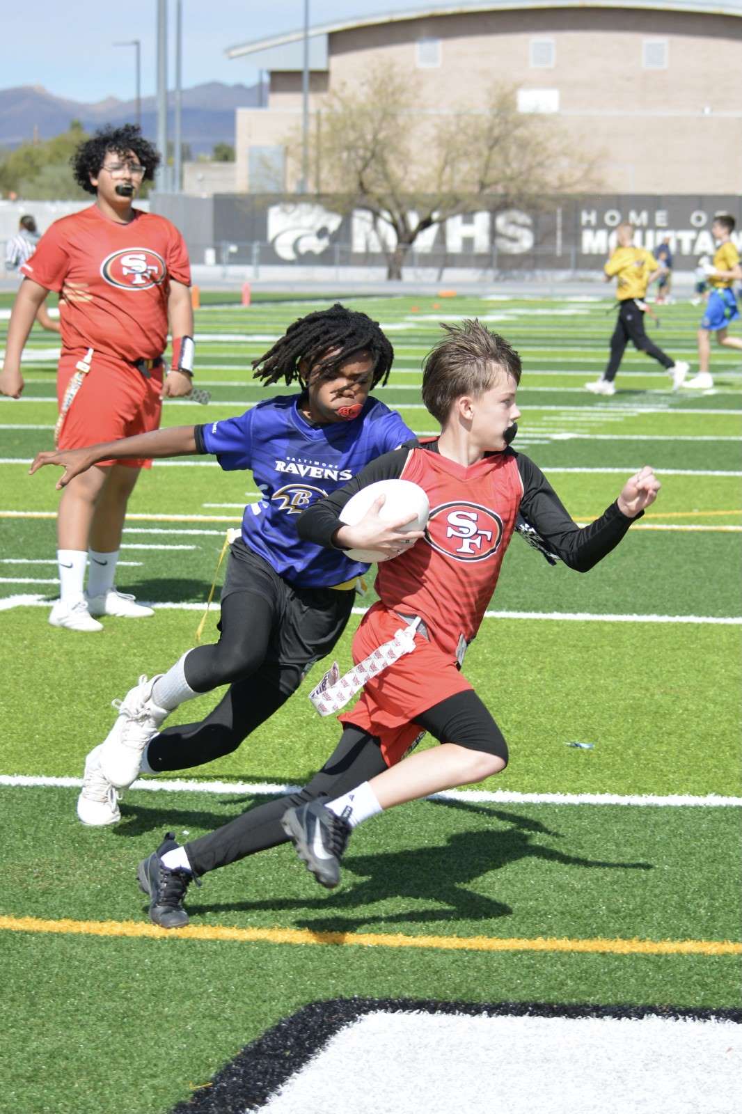 Ball carrier breaking free toward the end zone