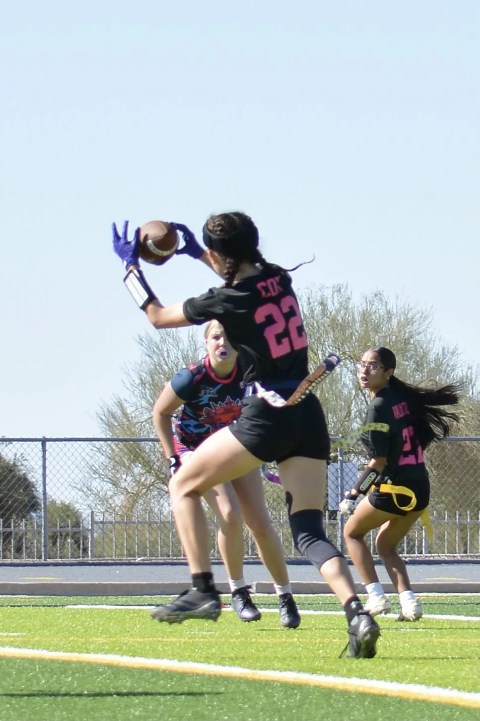 High school 7v7 receiver making a one-handed grab